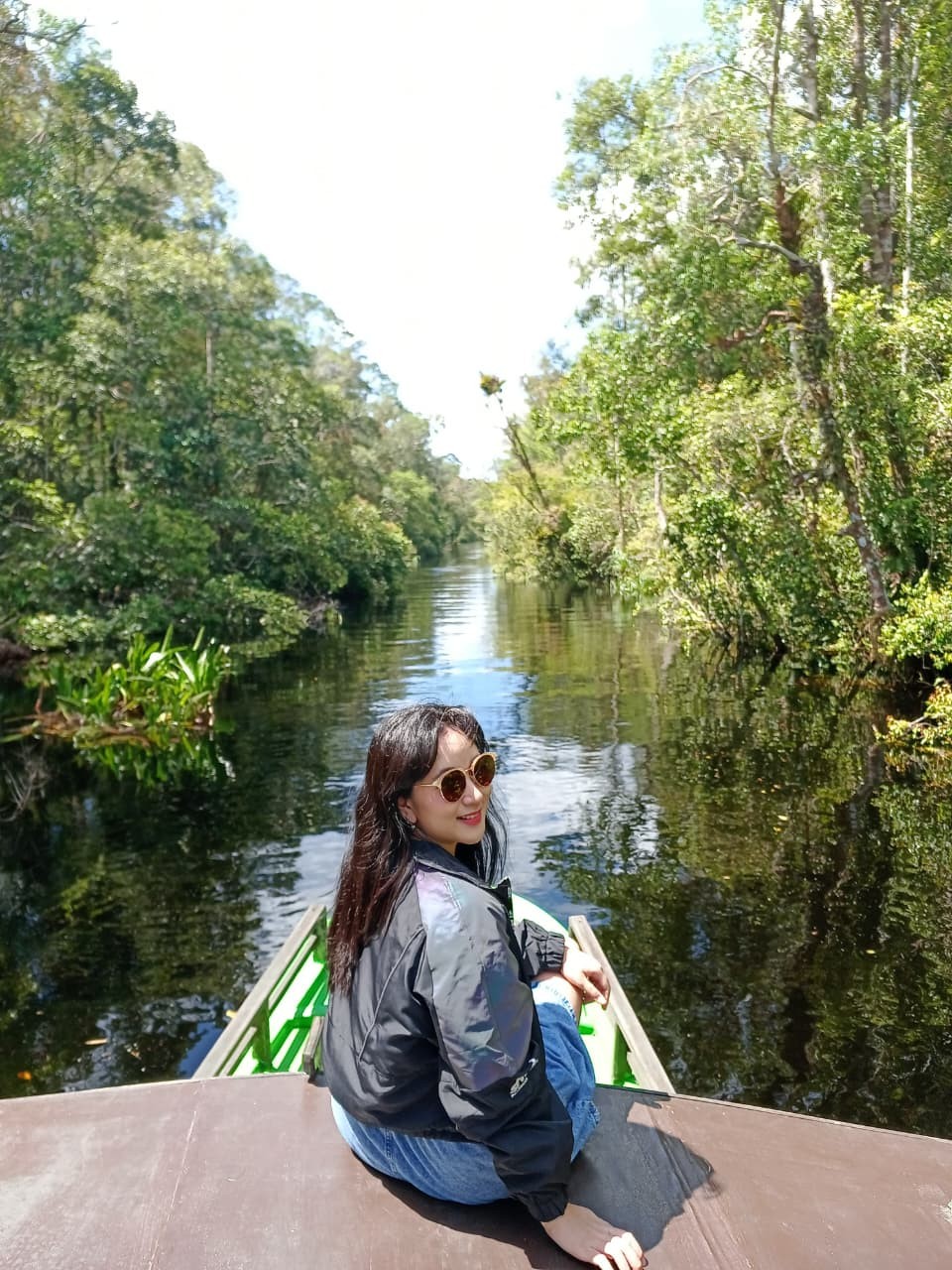A breathtaking mirror-like reflection of tropical forest on the calm blackwater river.